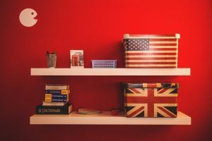 Two gift boxes with the Flags of U.S. and England on a floating shelf